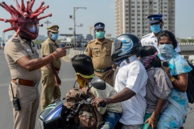Policeman wears corona virus helmet to warn people to stay home